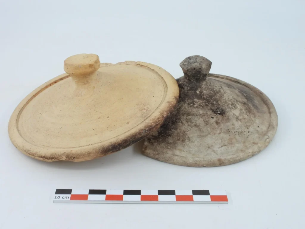 Ceramic lids discovered in the fill of the latrines, Strasbourg (Bas-Rhin), 2026. Credit: Clémentine Barbau, Inrap