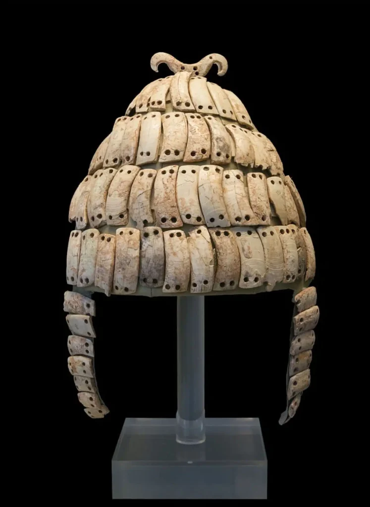 Mycenaean Greek boar tusk helmet from Mycenae, 14th century BC. On display at the National Archaeological Museum, Athens. Public Domain