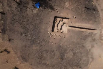 Aerial view of the Didé West 1 metallurgical site after the 2018 excavation campaign, showing a distinctive accumulation of used tuyères arranged in two semicircles. Credit: Camille Ollier