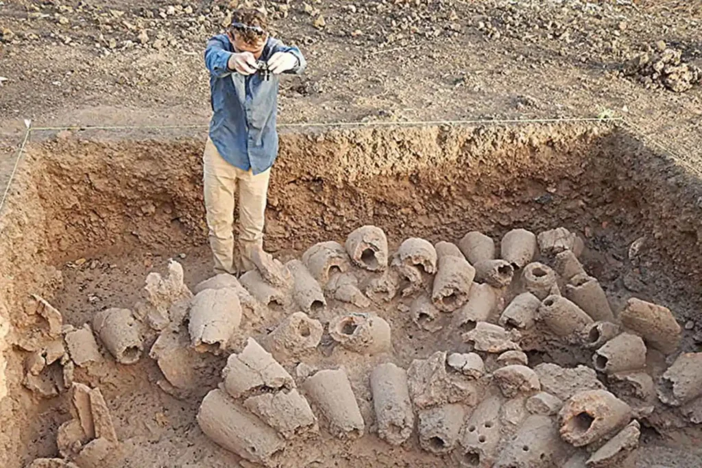 Photograph taken during the discovery of a pile of used tuyères, featuring intriguing transverse perforations, for photogrammetry purposes. Credit: Anne Mayor