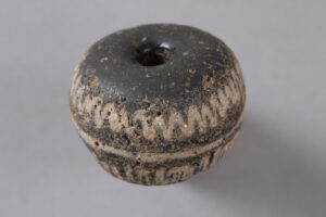 Strange Dark Glass Bead Found in 1,700-Year-Old Saxon Village May Have Been More Than Jewelry