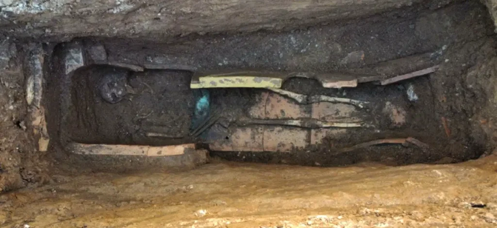 Burial laid in a tile bed with a bronze belt, discovered in the pre-Roman necropolis at Vasto. Credit: Ministero della Cultura (MiC)
