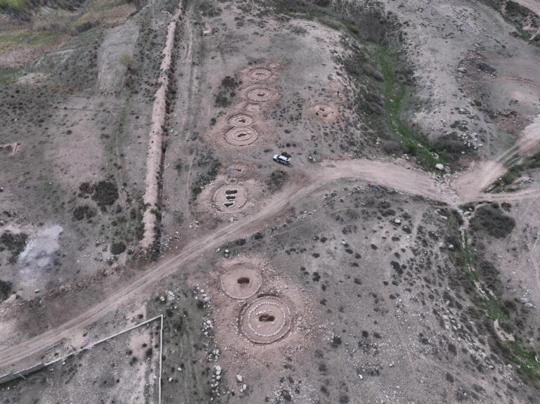 Aerial view of early Saka-period kurgan burials and circular stone structures uncovered during rescue excavations near Cholpon-Ata, Kyrgyzstan. Credit: Ministry of Culture, Information and Youth Policy of the Kyrgyz Republic