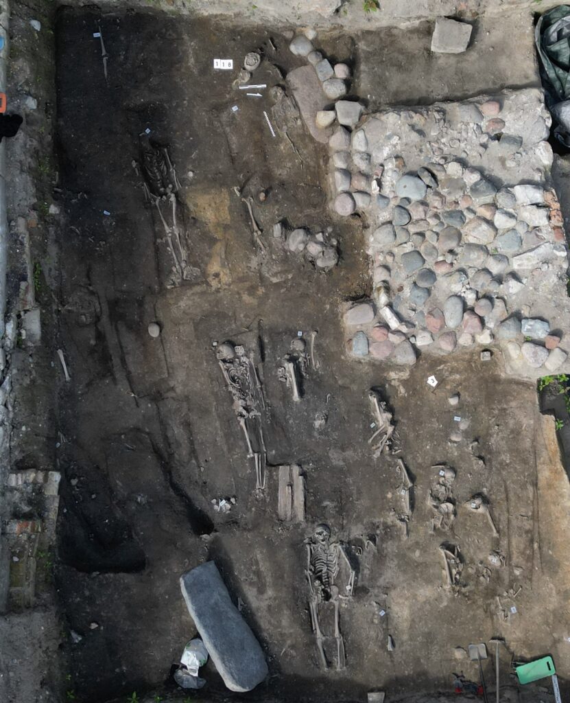 Such slabs are not ordinary grave markers. In 13th-century Gdańsk, stone tombstones were costly objects, usually reserved for people of elevated social rank. Credit: Pomorski Wojewódzki Konserwator Zabytków