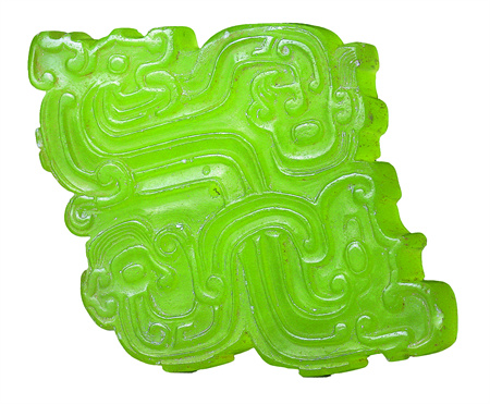A jade ornament with dragon patterns from the same site. Credit: CHINA DAILY