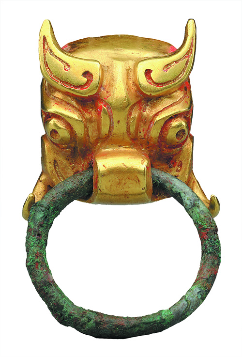 A gold beast-face ornament unearthed from the Changchun site in Fuping county, Shaanxi province. Credit: CHINA DAILY