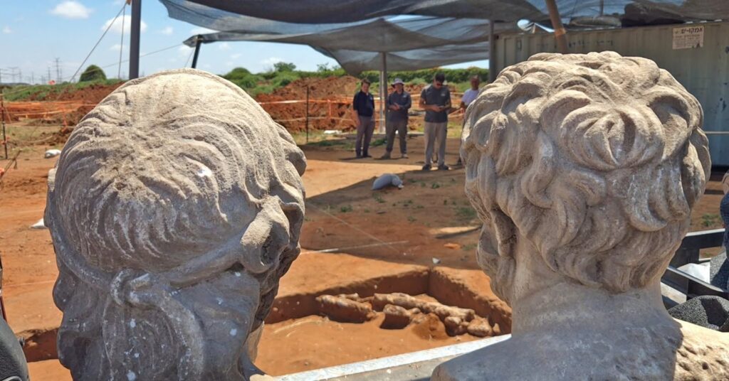 Two 1,700-year-old marble busts discovered inside a Roman-Byzantine wine collection pit near Binyamina. Credit: Emil Aladjem, Israel Antiquities Authority