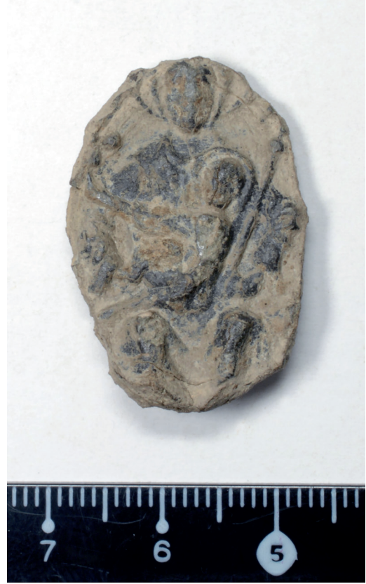 Pilgrim badge of pewter found in the field of Juva Farm in Masku, South-West Finland in 2016 (National Museum of Finland, inv. no. KM
41582:1). Size c. 3 x 2 x 0.6 cm.  Photo: the Archaeological Collections, Finnish Heritage Agency. Credit: Immonen, V. (2026)