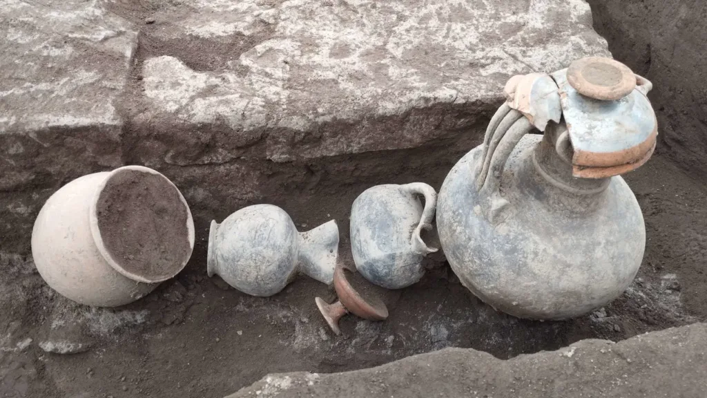 The necropolis on Via dei Pastai and artifacts recovered during the excavation. Credit: Soprintendenza ABAP Napoli.
