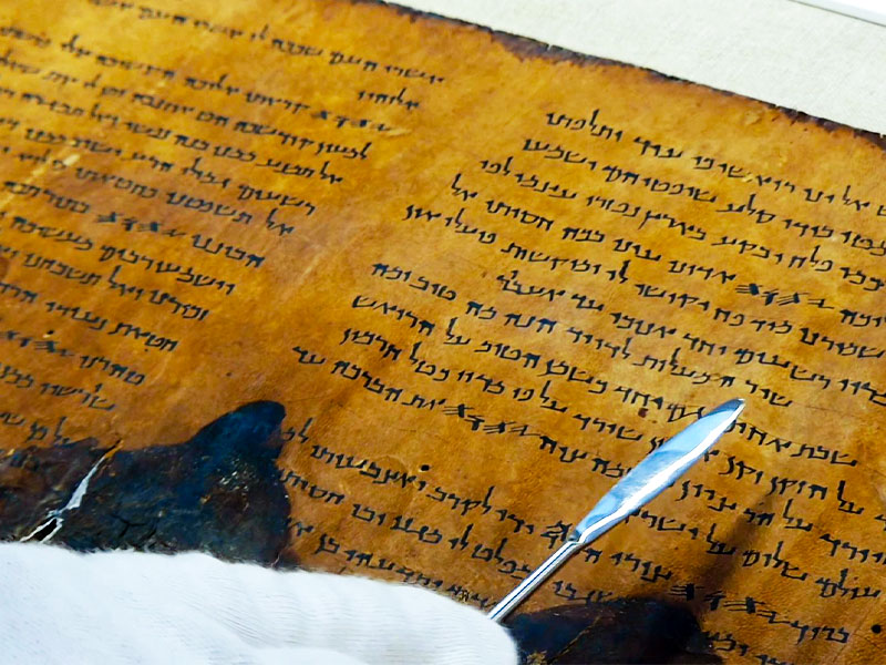 A fragment of a 2,000-year-old Psalms Scroll. Credit: Yoli Schwartz, Israel Antiquities Authority.