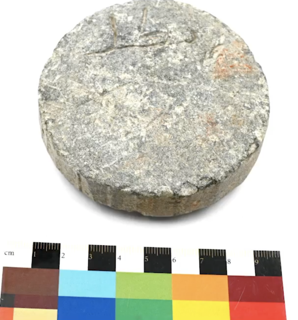 The stone weight inscribed with the word “ratl,” discovered at the Hillit archaeological site in Saudi Arabia. Credit: Saudi Ministry of Culture / Heritage Commission.