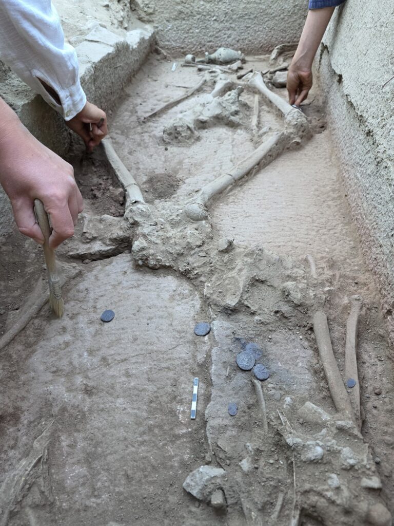 Aspendos coins featuring wrestler depictions, unearthed in the newly discovered tomb at the Eastern Necropolis of Aspendos Ancient City. Credit: Türkiye's Minister of Culture and Tourism, Mehmet Nuri Ersoy, via X