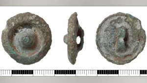 3,000-Year-Old Object Found with Bronze Axes Is Being Called a Button — But Archaeologists Aren’t Sure What It Was