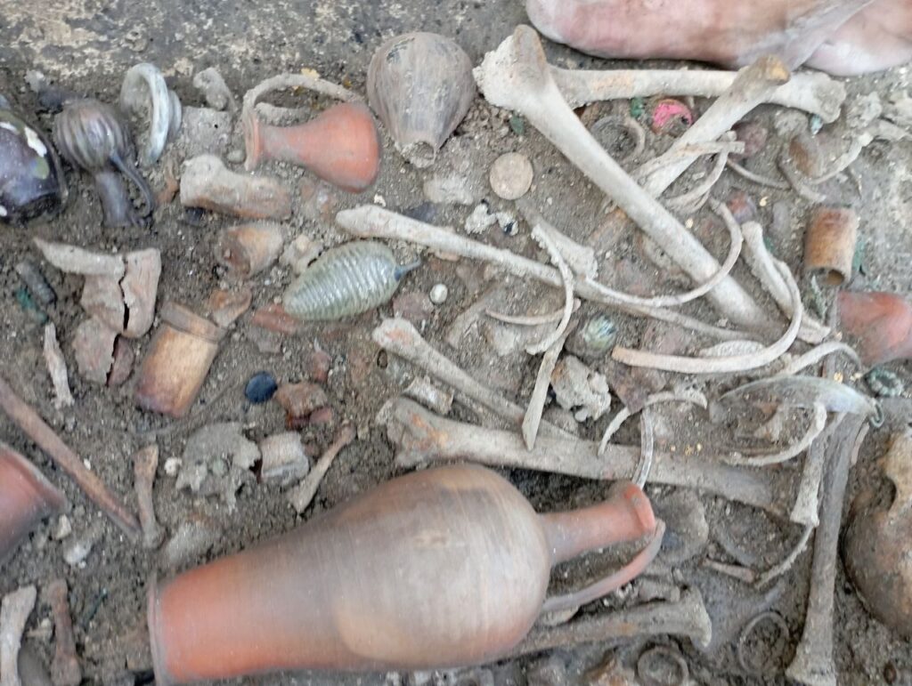 Southern Suburb necropolis, Chersonesos. Annion's grave goods as found in situ during excavation. Credit: Photo courtesy of Viktor V. Vakhoneev 
