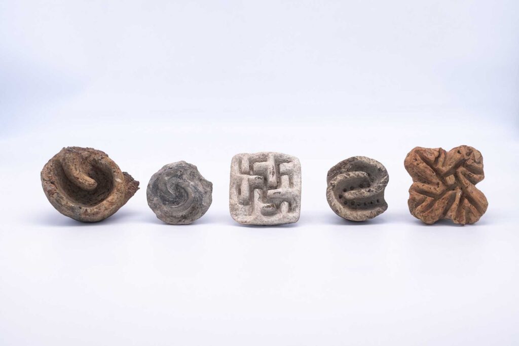 Terracotta pintaderas, likely used to decorate or mark bread during baking. Credit: University of Catania