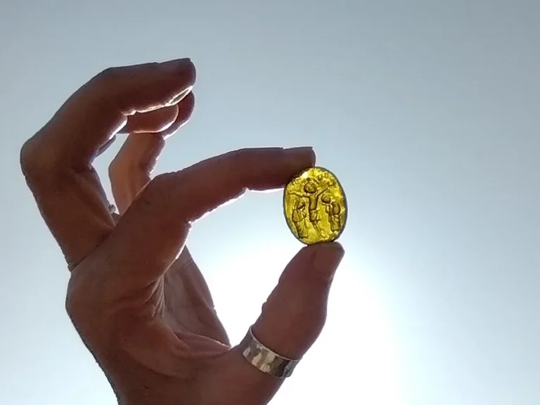 13th-century Venetian glass intaglio depicting the crucifixion, found near Leiston Abbey: likely a lost pilgrim's pendant or seal. Credit: Oxford Cotswold Archaeology (OCA)