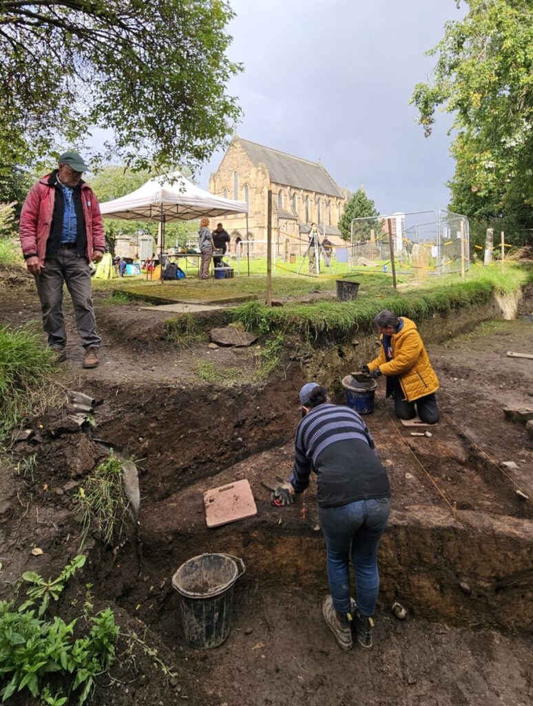 Archaeologists and volunteers excavating the churchyard at Govan Old in Glasgow, where evidence of early medieval jewellery production has been uncovered.