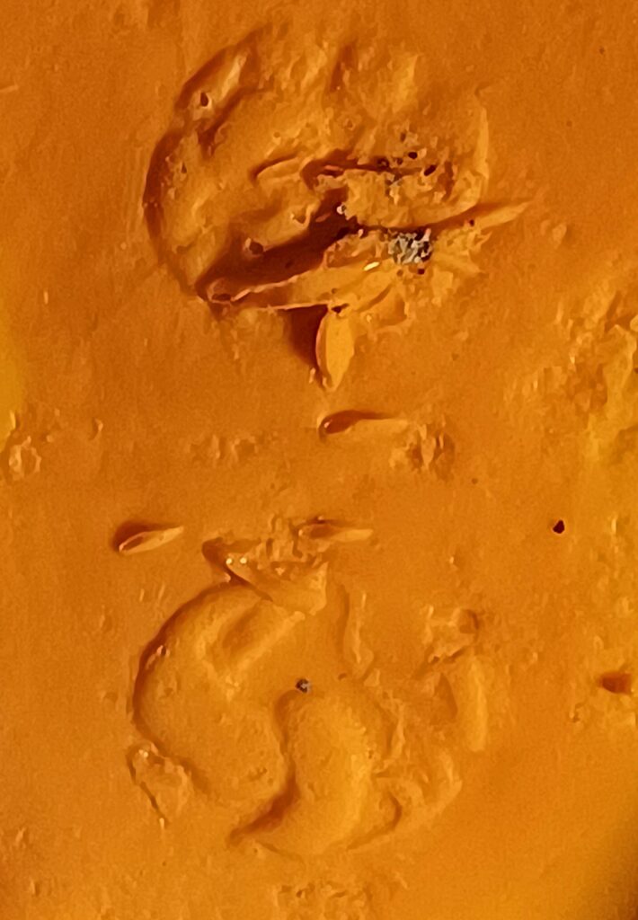 Detailed impression of an Arvernian stater design, revealing a horse and charioteer motif associated with the Corent mint