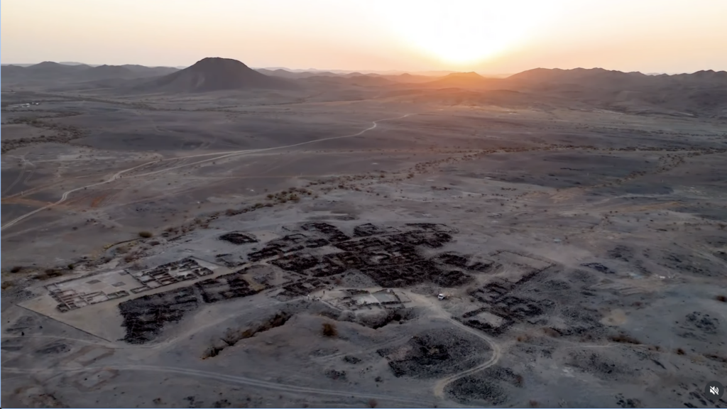 Aerial view of the Al-Ma'mala archaeological site and surrounding mountainous landscape in Al-Baha, Saudi Arabia.