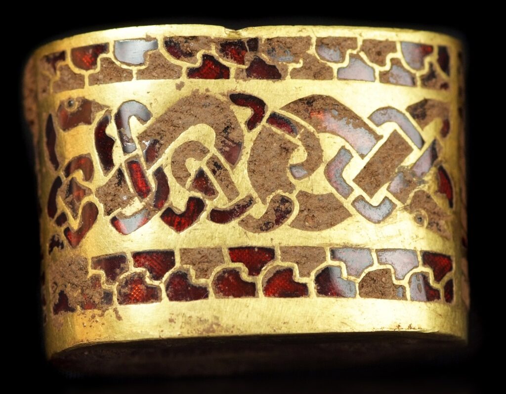 Ornate Anglo-Saxon sword hilt fitting from the Staffordshire Hoard, find number NLM 449.