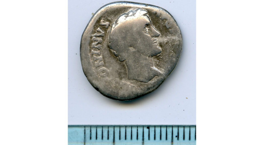 Ancient Roman silver coin bearing the portrait of Emperor Antoninus Pius, discovered at Tofta on Sweden's Gotland island.