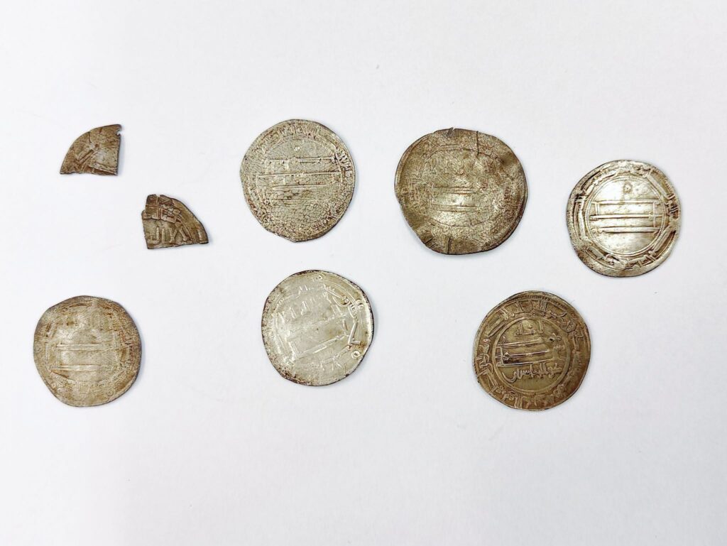 Six 9th-century Arab silver dirhams and two coin fragments found near Truso in northern Poland
