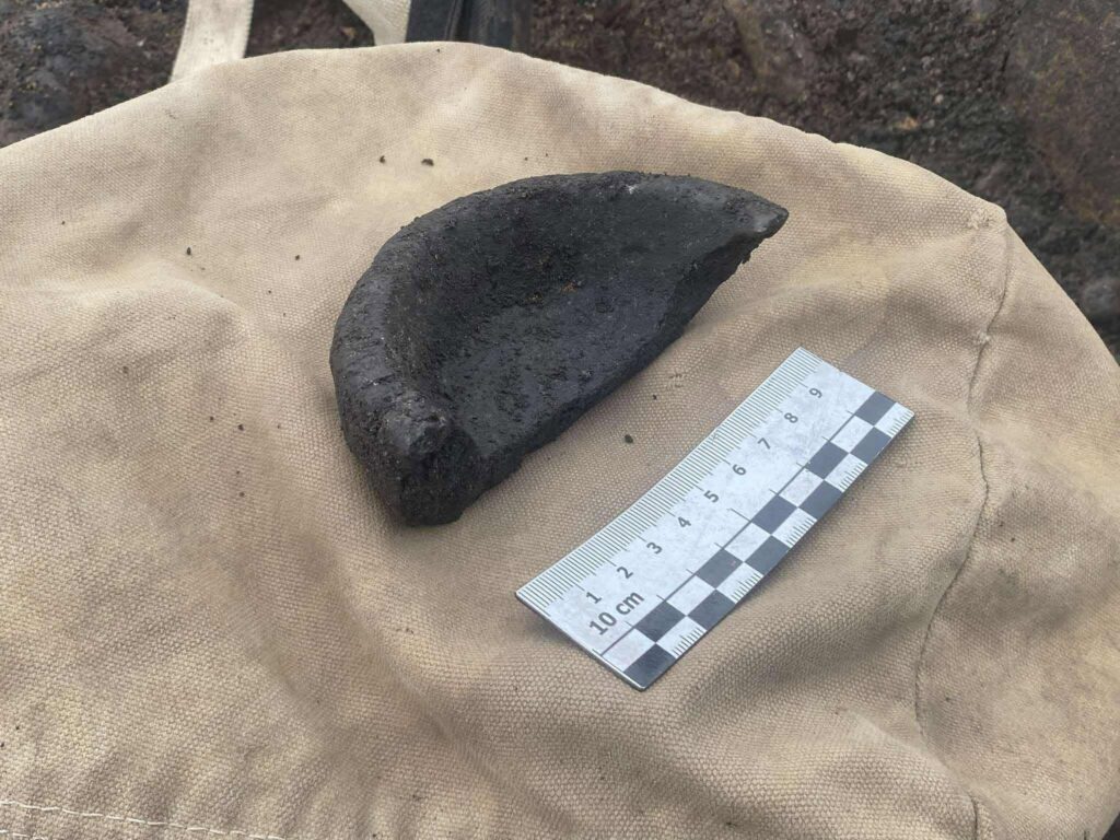 Fragment of a possible steatite bowl or lamp found in the Iron Age burial structure at Evelix Quarry in Scotland.