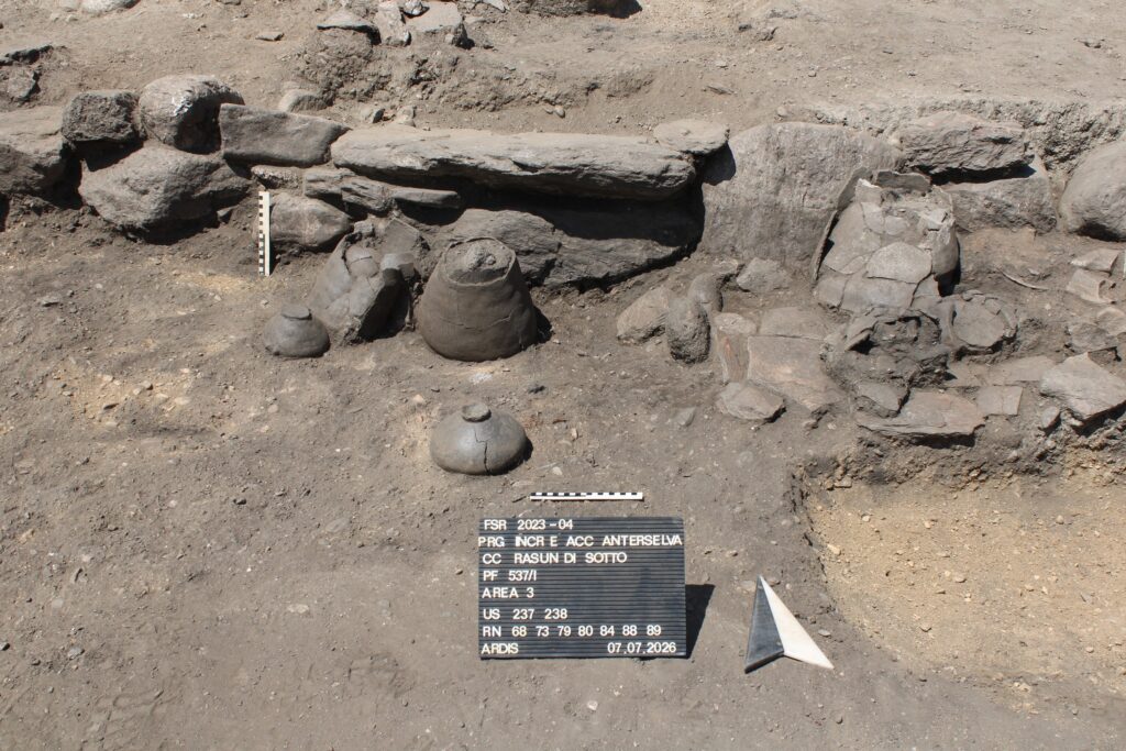 Iron Age house remains with ceramic vessels at Galgenbichl in Niederrasen, South Tyrol.