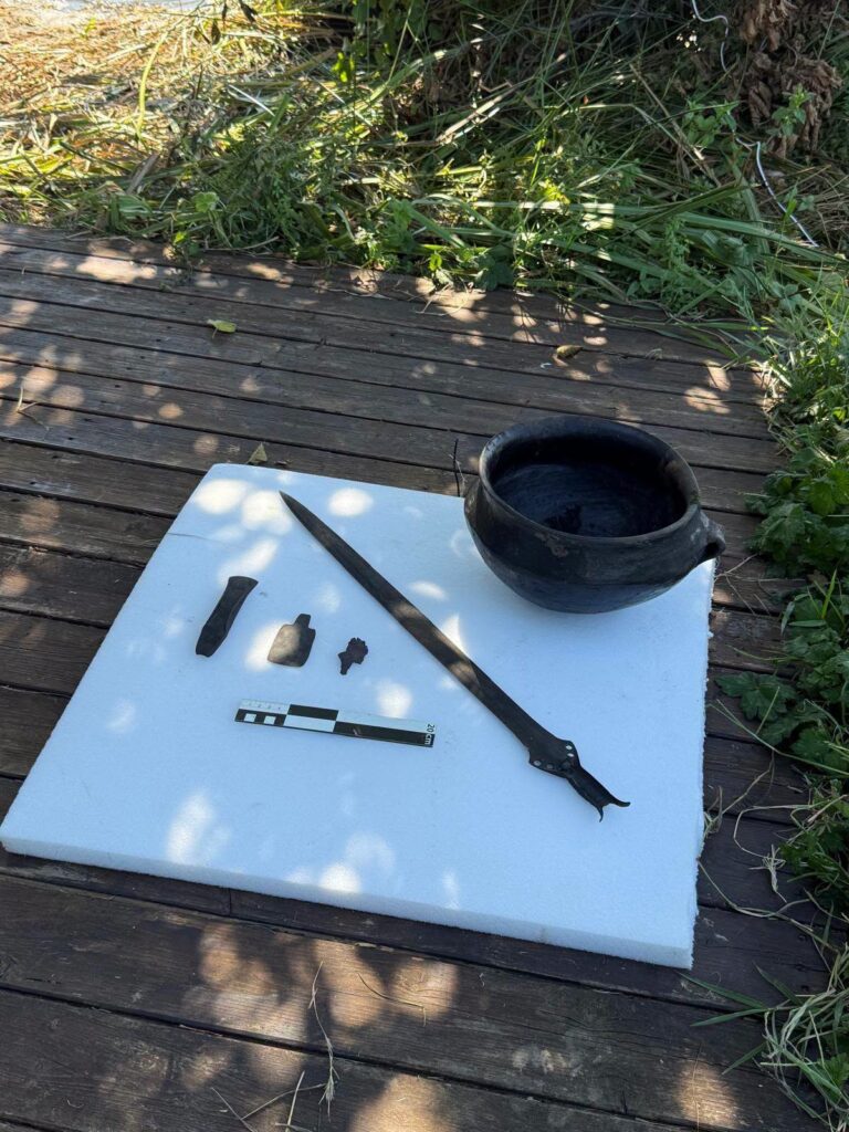 Bronze Age sword, pottery vessel and bronze artifacts recovered from Lake Mezzano in Italy.