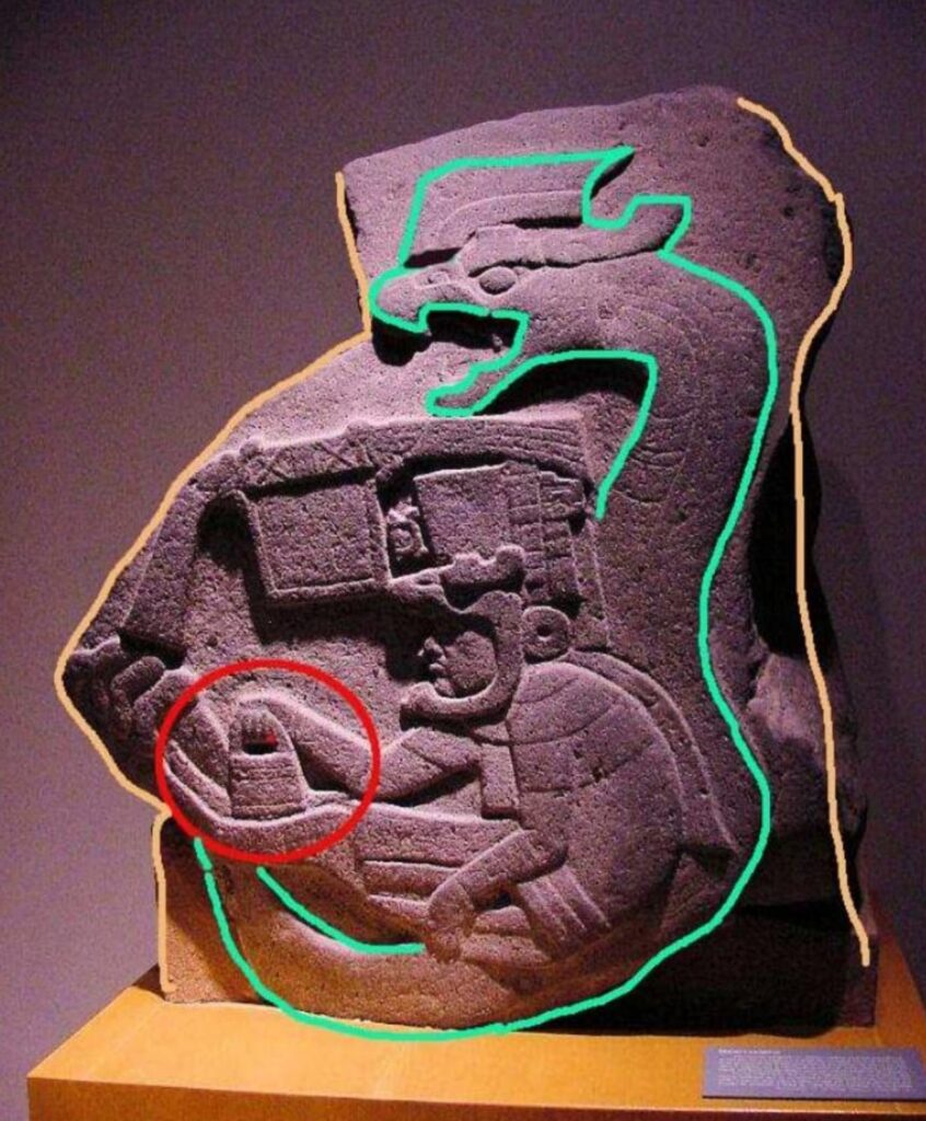 La Venta Monument 19, an Olmec relief from ancient Mesoamerica, depicts a seated figure within a feathered serpent motif while holding a rectangular, bag-like object. The much later image is sometimes compared visually with Göbekli Tepe’s “handbag” symbols, although no historical connection between the two traditions has been demonstrated. Credit: İHA