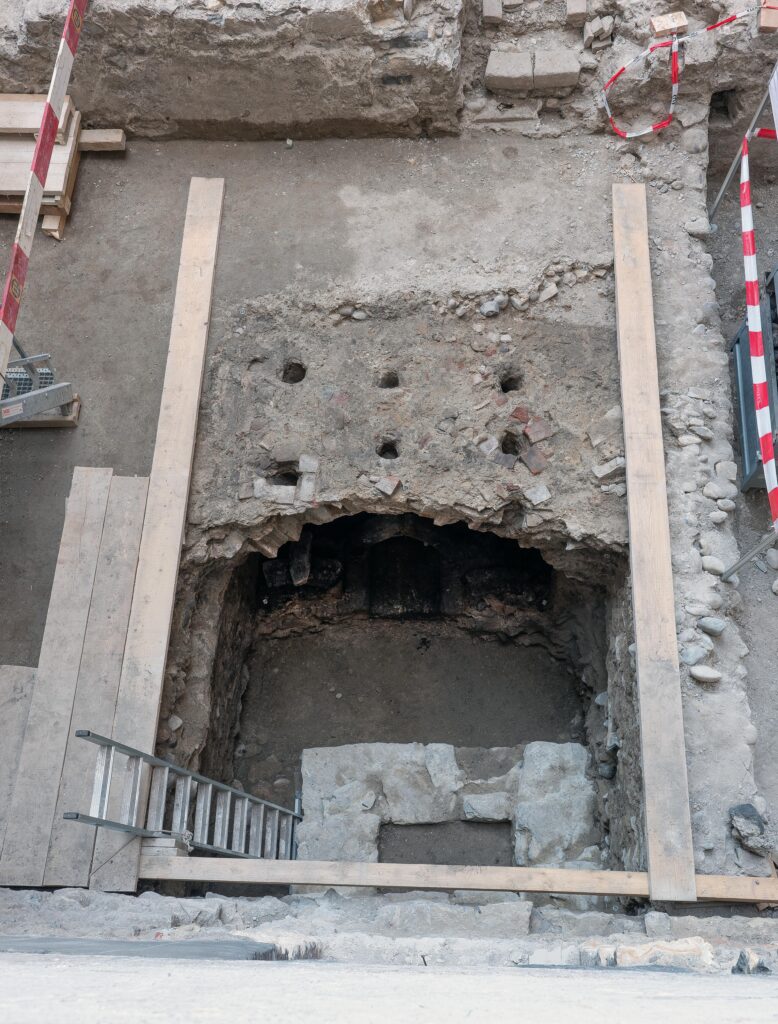 View of the medieval convent’s refectory floor, showing the openings through which warm air from the underground heating system entered the dining hall. 