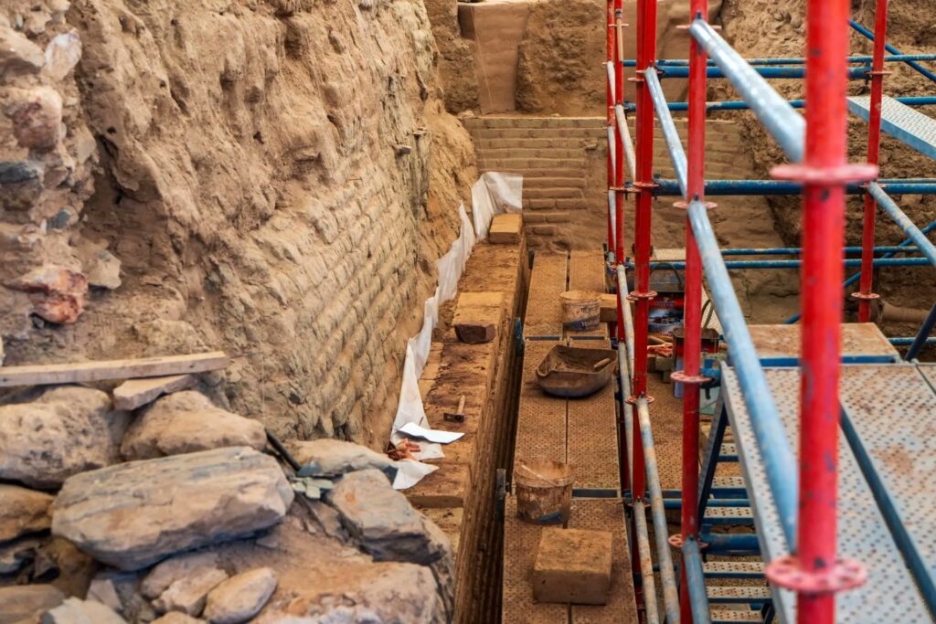 Conservation work at Sardis showing a protective layer and newly laid bricks beside the ancient Lydian mudbrick wall.