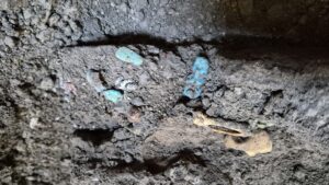 2,000-Year-Old Cupboard in Pompeii Reveals 24 Protective Amulets and 38 Coins