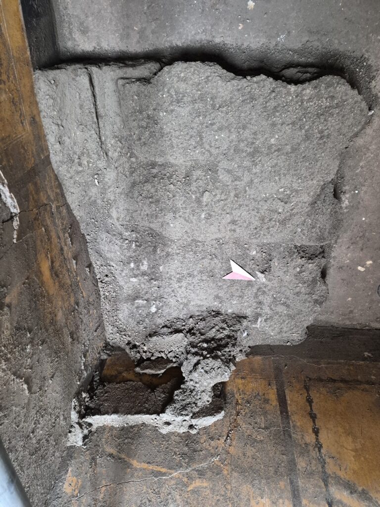 Excavated remains and impressions of a Roman wooden cupboard discovered inside an ancient Pompeii house.
