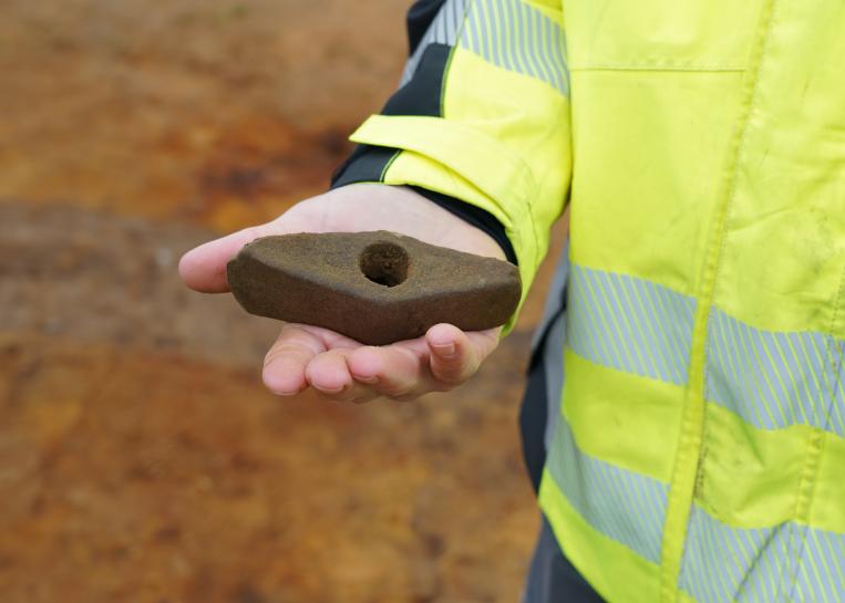 A 4,500-year-old stone battle axe discovered in a prehistoric grave during archaeological excavations in West Jutland, Denmark.
