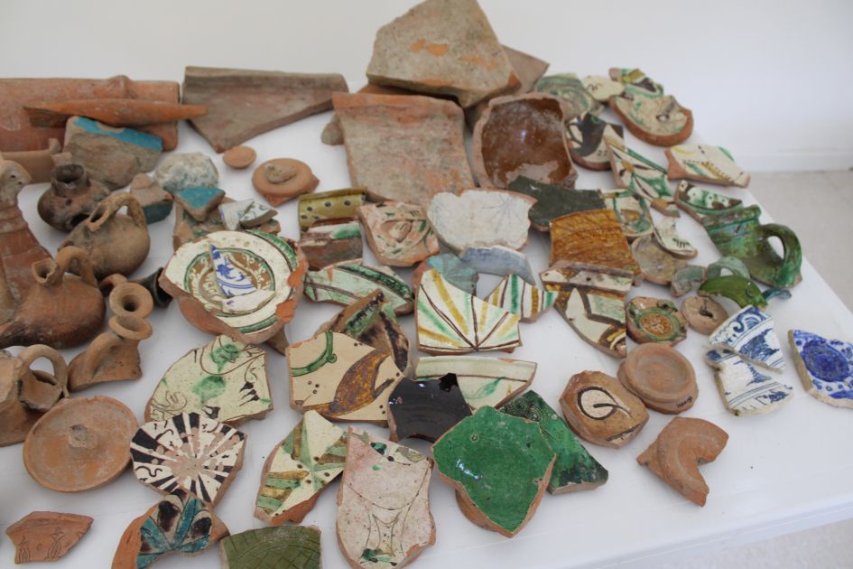 Collection of decorated glazed and unglazed pottery fragments discovered during archaeological excavations in Gabala.