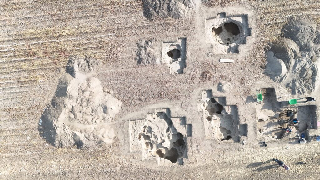Aerial photograph showing archaeological excavation trenches and deep pits at the early medieval Bostanište settlement.