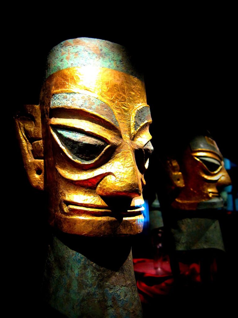 Ancient bronze heads with gold foil face coverings from the Sanxingdui archaeological site in China.