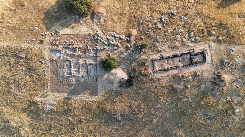 Aerial view of excavation areas and ancient building remains at the fortified Iron Age settlement of Cerro del Gollino in Spain.