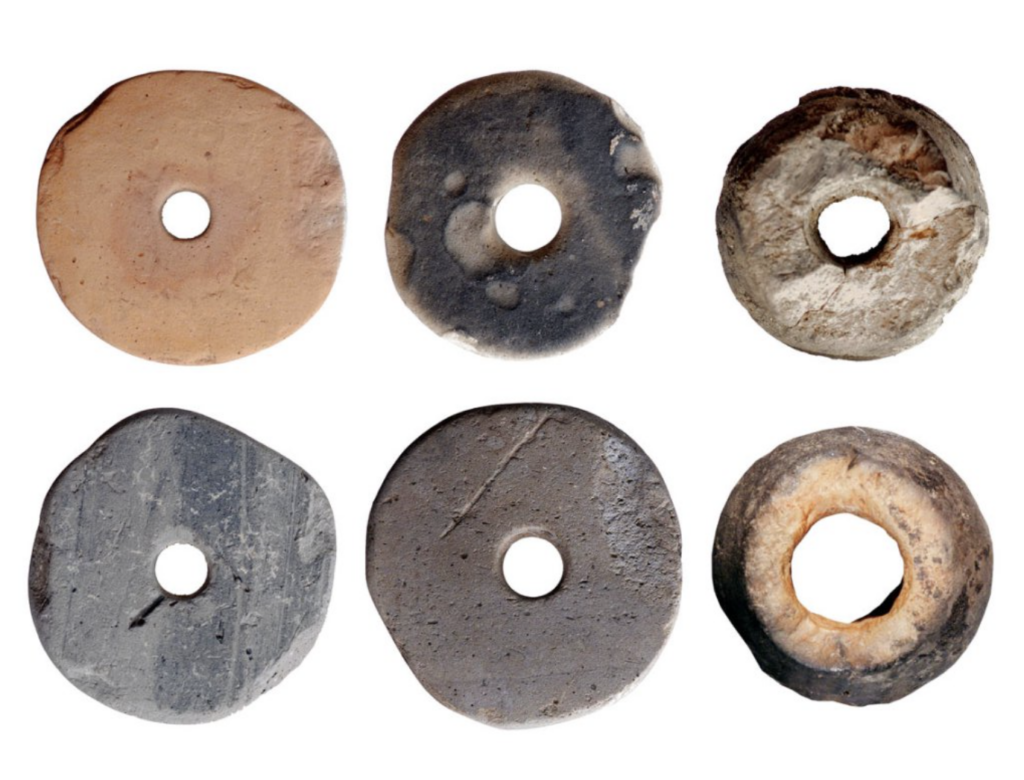 Clay spindle whorls used for spinning thread, discovered in seventh-century Avar women's graves in Hungary.