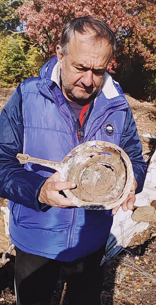 Bulgarian archaeologist Ivaylo Kanev holding an ancient archaeological artifact during excavations at Balak Dere.