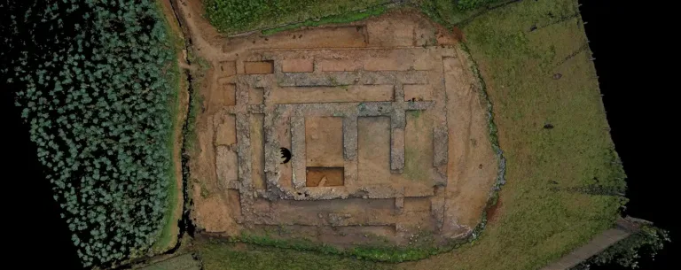 Aerial view of the excavated walls and rectangular layout of the ancient Jandial D complex near Taxila, Pakistan.