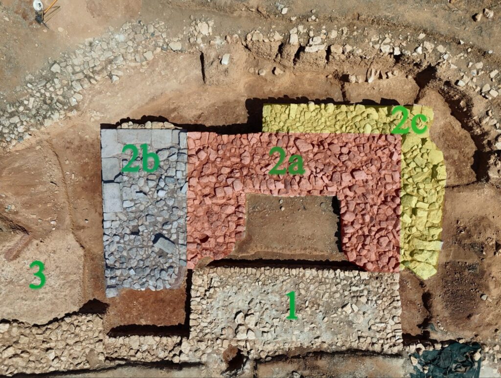 Annotated archaeological plan of the Marchello fortifications showing the original bastion, its enlargement into a tower, subsequent wall reinforcements, and a marl deposit beside the rampart.