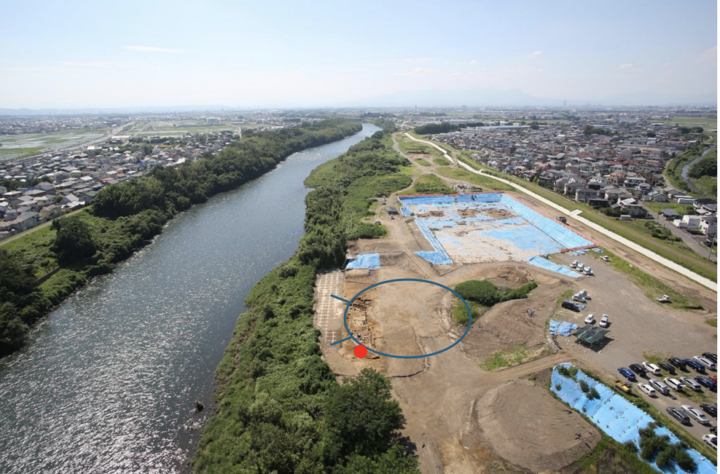 Aerial photograph of the Nishikaminomiya excavation site in Japan, showing Tomb No. 1 outlined in blue and the female haniwa discovery location marked in red.