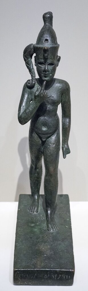 Ancient statue of Harpocrates (Child Horus), known as the Madrid Statue, illustrating Egyptian religious influences in the Mediterranean world.