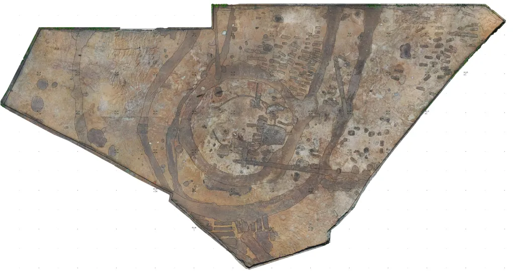 Aerial archaeological plan showing two circular ditches around the presumed medieval windmill site and graves from the later Lutheran cemetery at Windmill Hill in Puck.