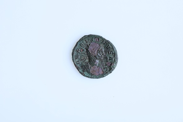 Ancient Roman coin bearing the portrait of Emperor Aurelian, discovered in a 1,750-year-old child's grave in Stara Zagora, Bulgaria.