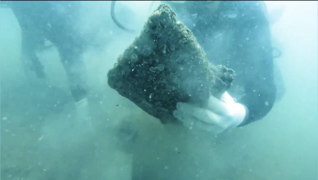 A diver recovers the torpedo jar fragment during underwater exploration off Poompuhar, Tamil Nadu.