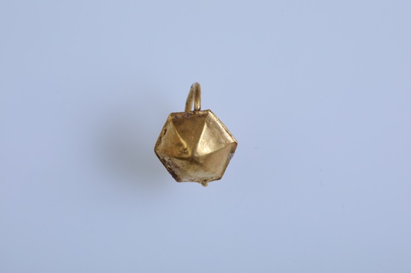 
Close-up of an ancient geometric gold earring recovered from a Roman child's burial in Stara Zagora, Bulgaria.
