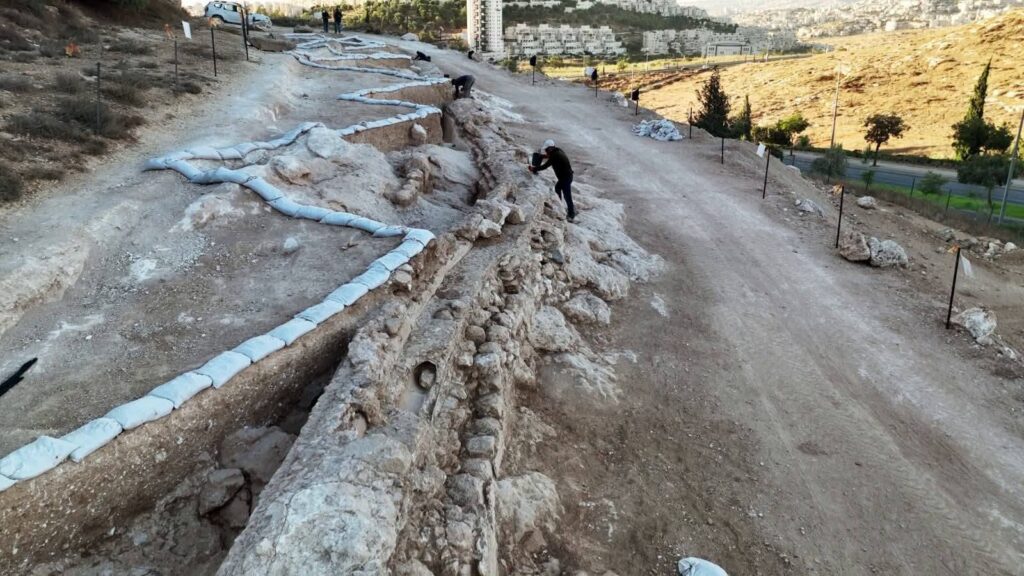 Ancient stone water channel with ceramic pipes from the Ottoman period exposed during excavations near Jerusalem.